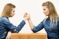 Two women having arm wrestling fight Royalty Free Stock Photo