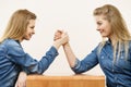 Two women having arm wrestling fight Royalty Free Stock Photo