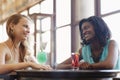 Two women having fun in pub Royalty Free Stock Photo