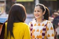 Two women having fun at Surajkund Mela