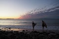 Two women heading out for a surf with their boards in Noosa to illustrate female empowerment and friendship Royalty Free Stock Photo