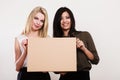 Two women holding blank board Royalty Free Stock Photo