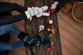 Two women in holiday socks enjoying coffee and cookies