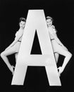 Two women with huge letter A