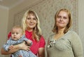 Two women and infant. Royalty Free Stock Photo