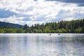 Two women Kayaking on a pristine mountain lake in the state of Washington Pacific Northwest. Royalty Free Stock Photo