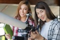 Two woman looking through telescope Royalty Free Stock Photo