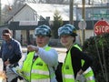 Two women looking at the direction of emergency situation