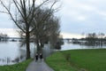 Two women looking at high water in river Rhine