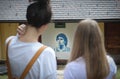 Two women looking at Maradona mural on the house wall Royalty Free Stock Photo