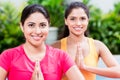 Two women in lotus position during yoga practice Royalty Free Stock Photo
