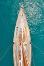 Two women lying on a boat sunbathing using smartphones to send text messages from above. Two friends on holiday cruise Royalty Free Stock Photo