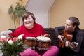 Two women make a music therapy Royalty Free Stock Photo