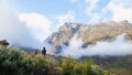 Two women in the mountains having a talk and watching a blissful sunrise Royalty Free Stock Photo