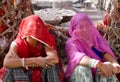 Two women at Om Banna shrine, Jodhpur, India, for a motorcycle god