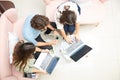 Two women and one man businessmen working informally on their computers in their office chairs Royalty Free Stock Photo