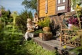 Two women, one young and the other older peel goldenrod flowers into a basket. Royalty Free Stock Photo