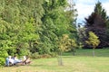 Two women pensioners are resting in city park in nature. Elderly people