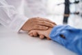 Two women pharmacist and customer with hands together at pharmacy Royalty Free Stock Photo