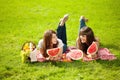 Two women on a picnic with watermelon