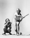 Two women playing baseball Royalty Free Stock Photo