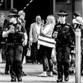 Two Women Police Officer Carrying Cups Of Takeaway Coffee Royalty Free Stock Photo