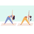 Two women practicing yoga together, group of women performing gymnastic exercise in gym, aerobics class, training Royalty Free Stock Photo