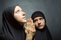 Two women pray