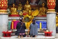 Two - women - prayers - Thailand;
