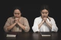 Two women are praying for God`s blessing. The idea of praying to the Lord with patience and steadfastness. May God strengthen you Royalty Free Stock Photo