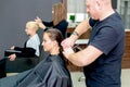 Young caucasian woman receiving haircut Royalty Free Stock Photo