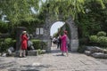 Two women in red dresses took photos in the scenic spot