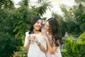 Two Women Relaxing On Rooftop Garden Drinking Coffee Royalty Free Stock Photo