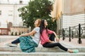 Two women resting on the stairs