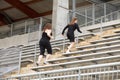 Two women running stairs Royalty Free Stock Photo