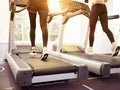 Two women running on treadmill in gym Royalty Free Stock Photo