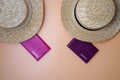 Two women`s beach straw boater hats, passports on a beige background. Trip, travel and tourism concept Royalty Free Stock Photo