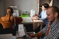 Two women sewing clothes in the background Royalty Free Stock Photo