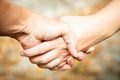 Two women shaking hands outdoors. Team work and agreement setting concept. Women solidarity and support. Caucasian palm Royalty Free Stock Photo