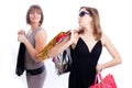 Two women shopping in a white background.