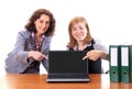 Two women showing display of notebook