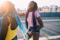 Two women sisters outdoor listening music dancing Royalty Free Stock Photo