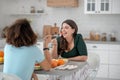 Two women sitting at the table eating salad. Royalty Free Stock Photo