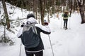 Two women snowshoeing together in the forest Royalty Free Stock Photo