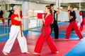 Two women sparring during karate training in gym Royalty Free Stock Photo