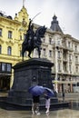 Two women stand near the equestrian statue of Ban Josip Jelacic in Zagreb, Croatia.