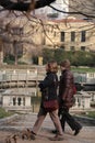 Two women stroll in the Guastalla gardens in Milan. Water tank in the Guastalla gardens..Traditional Italian garden with a pond in