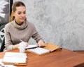 The girl ate bread for breakfast. While reading a book in the university library Royalty Free Stock Photo