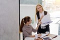 Two women are studying and teaching Royalty Free Stock Photo