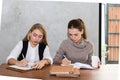 Two women are studying and teaching Royalty Free Stock Photo